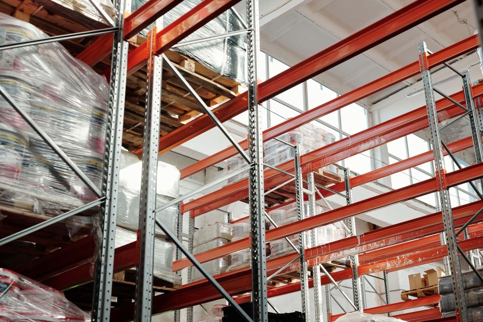 Bright warehouse interior with tall pallet racking